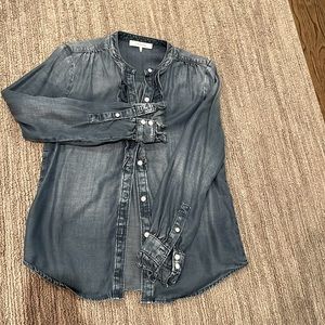 Frame denim button down with ruffle detail.